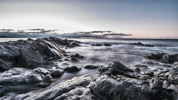 cloudy beach sea beach rocks ocean