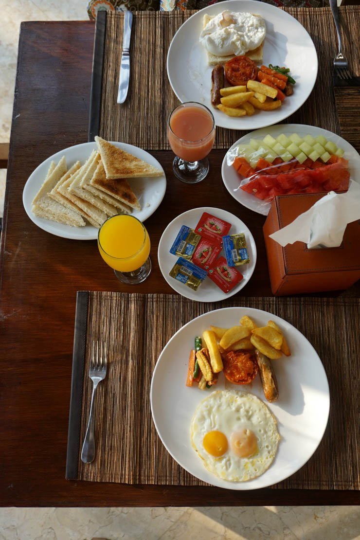 food meal meals restaurant cook cooking eat dish breakfast ruit fruits omlette fries egg juice orange bread plate fork knife table