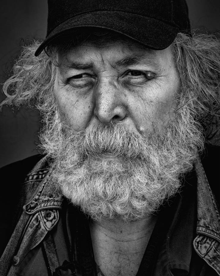 homeless man beard old black white cap hat