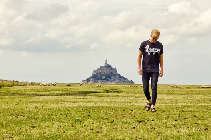man adult tshirt castle field farm sky cloud clouds cloudy