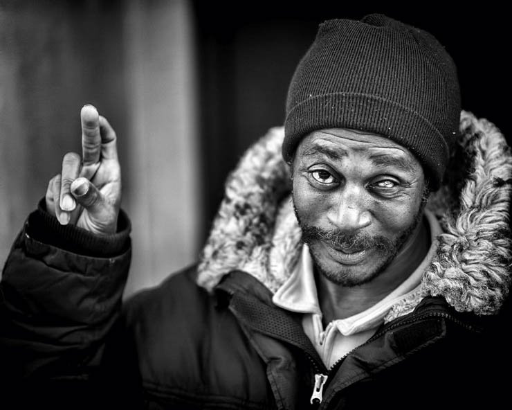 man expression happy gesture jacket hat cap