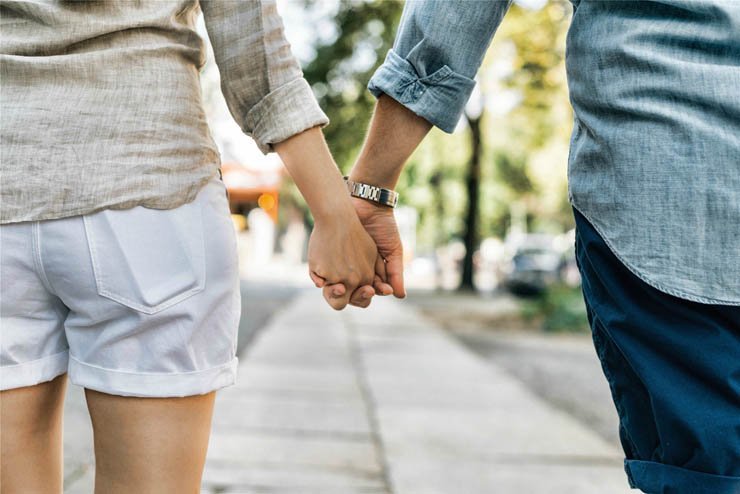 man woman holding hands walk walking romantic romance love summer couple outdoor