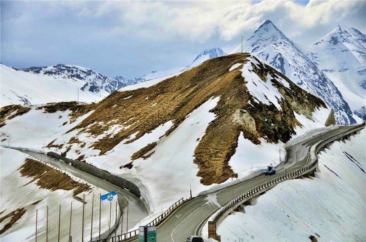nature natural sky snow snowy winter road trip cross mountain mountains cloud cloudy clouds