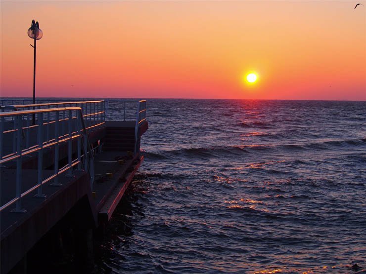 nature natural sky water sea ocean wave waves sun sunset platform evening
