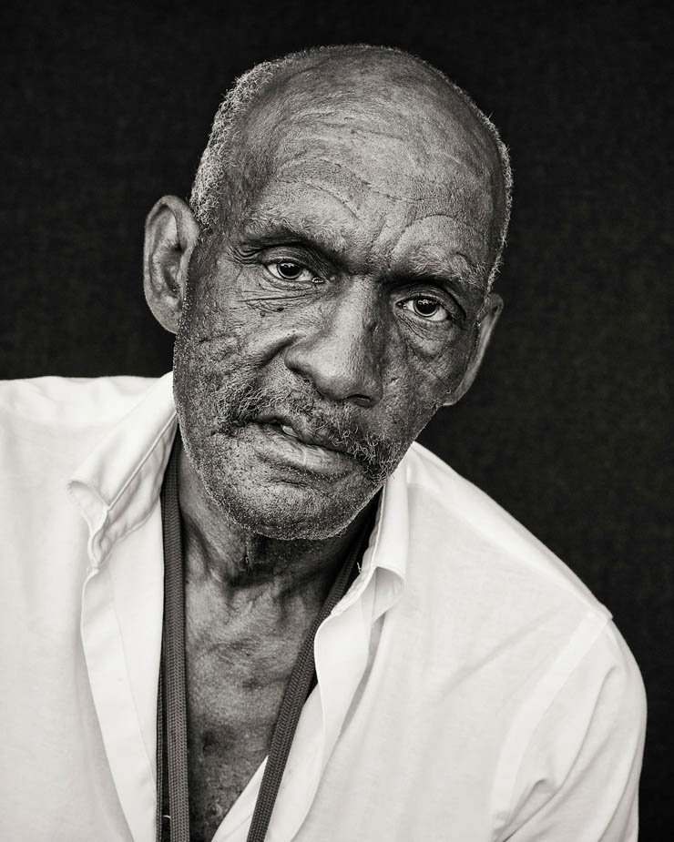 old man face black white bald head