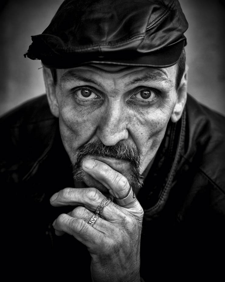 suspect man old hand ring rings hat black white