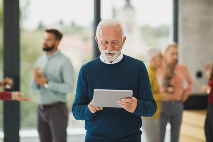 business finance formal job work employee seniot boss manager tablet review reading read meeting