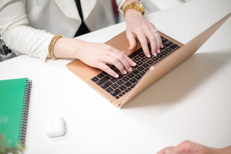 business finance formal job work employee working hand hands office desk laptop woman women female