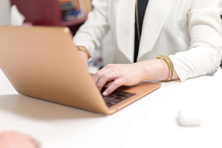 business finance formal job work employee working laptop programmer developer woman female code coding boss manager office desk