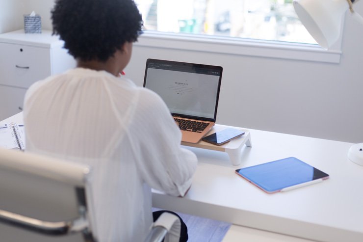 business finance formal job work employee working office desk clean woman women female boss leader manager laptop tablet