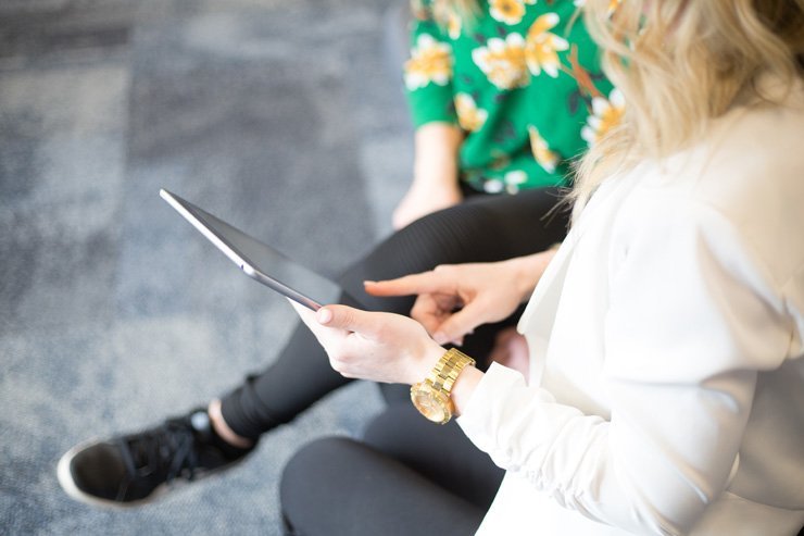 business finance formal job work employee working tablet meeting discussion women woman office desk colleagues colleague