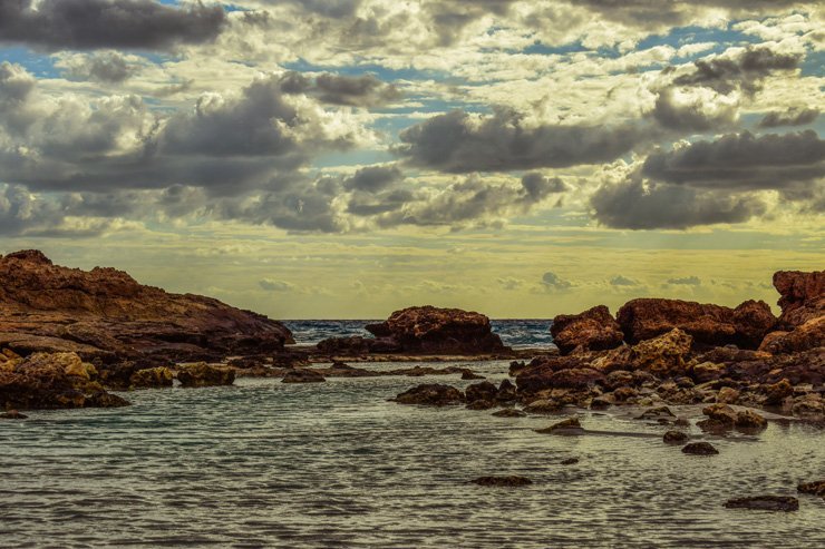 water nature sea sky ocean clouds cloudy landscape summer rocks rock island stones
